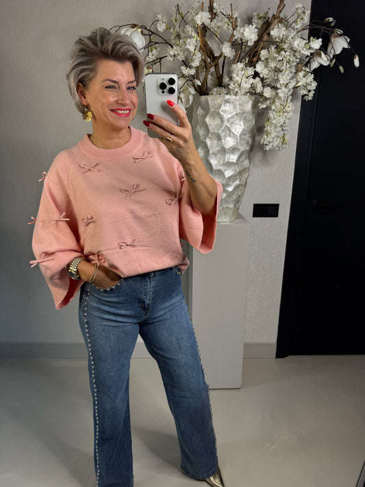 Trui strikjes roze
