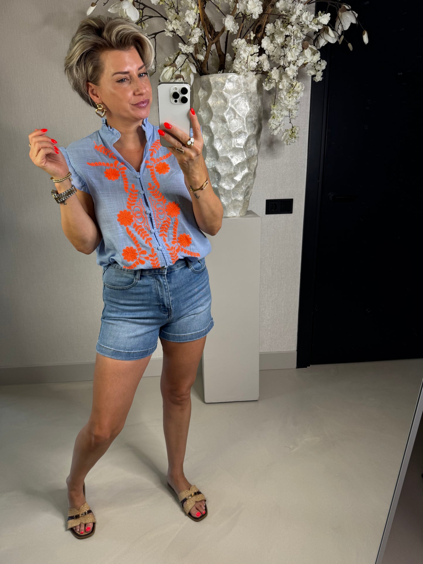 Blouse mouwloos oranje bloemen